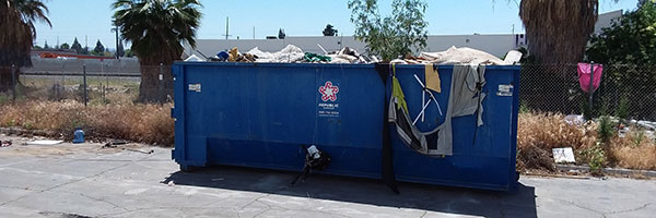 Homeless Encampment Dumpster