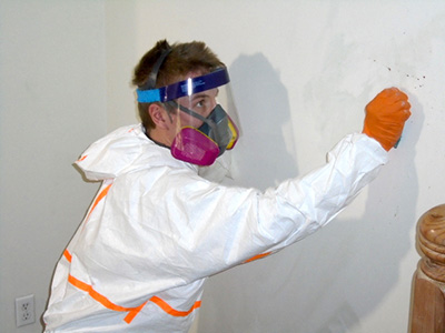 Biohazard Tech Cleaning a Wall