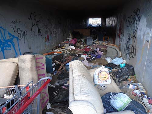 tunnel full of debris from a homeless encampment