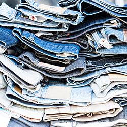 stack of jeans - clothing hoarding