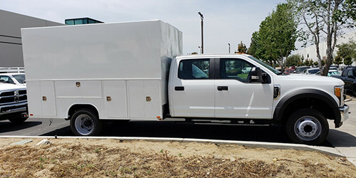 Bio SoCal's white unmarked truck parked sideways