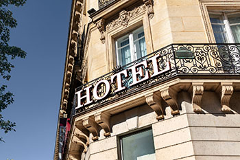 hotel with a hotel sign on decorative wrought iron railing